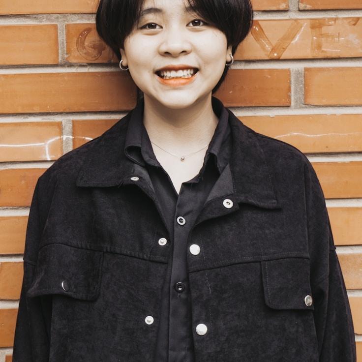 Asha Mira, Lead Design Curator at ModestGrainRoute, reviewing corporate floral arrangements